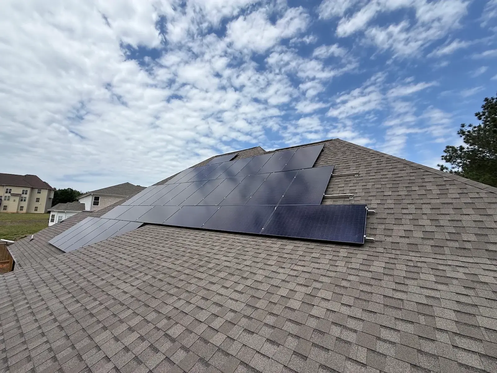 Rooftop solar panel installation on a suburban home in Georgia